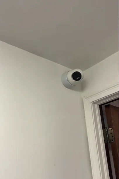 Indoor camera at a wall and ceiling corner