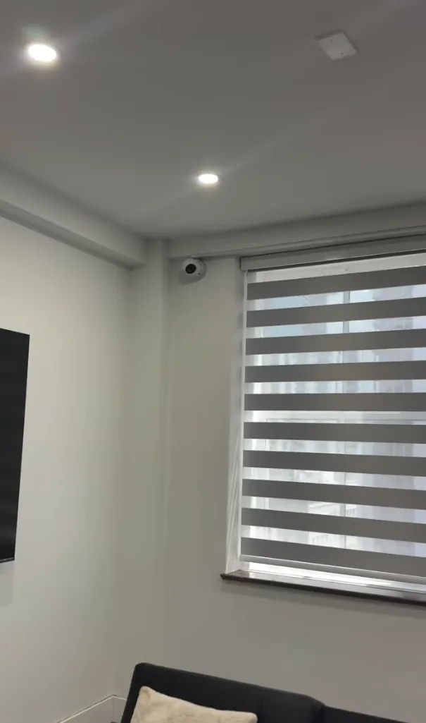 Camera above a window in a living room